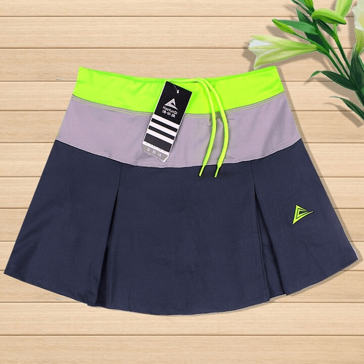 Women's breathable tennis skirt-shorts with pocket in navy, green, and gray hues, perfect for sports and outdoor activities.